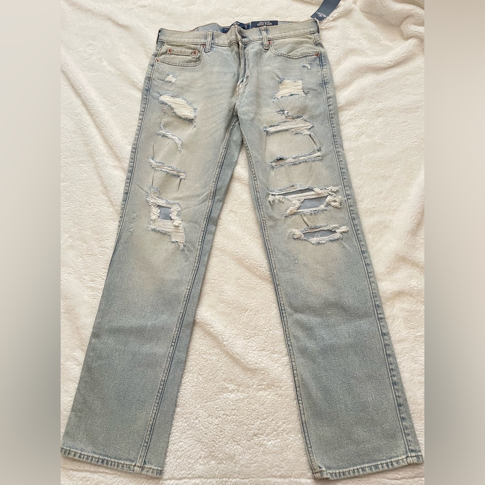 Light wash distressed denim jeans